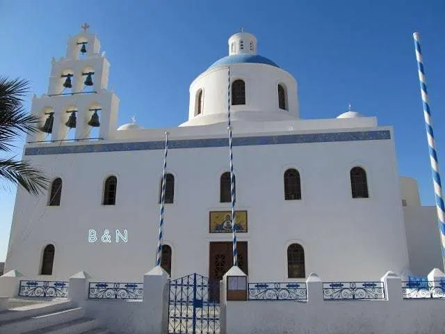 exploring the white houses of Oia village in Santorini in Greece