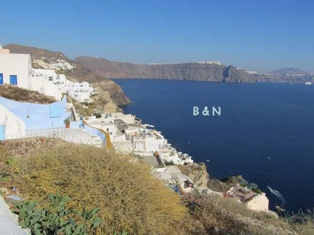 exploring the white houses of Oia village in Santorini in Greece