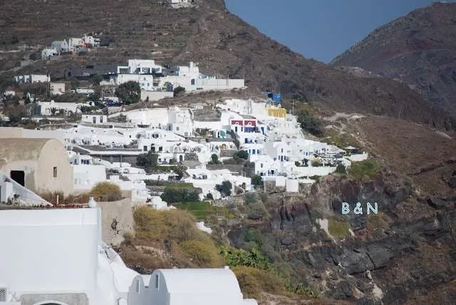 exploring the white houses of Oia village in Santorini in Greece