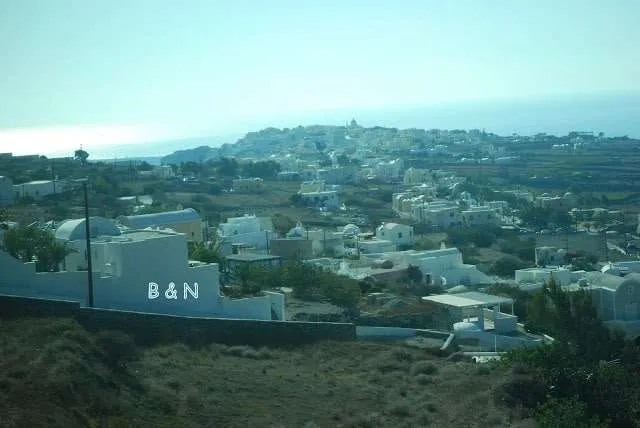 exploring the white houses of Oia village in Santorini in Greece