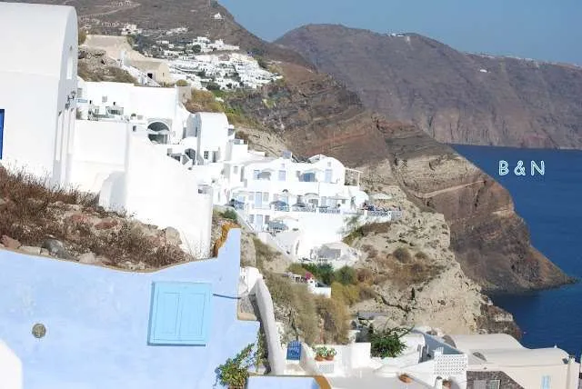 exploring the white houses of Oia village in Santorini in Greece
