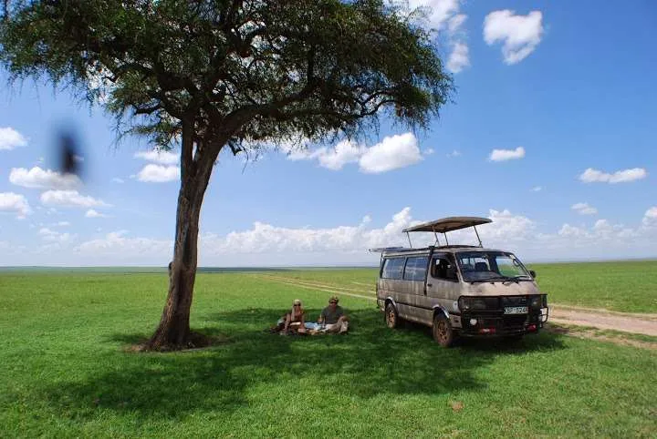 picnic, safari and village in Maasai Mara National Reserve in Kenya