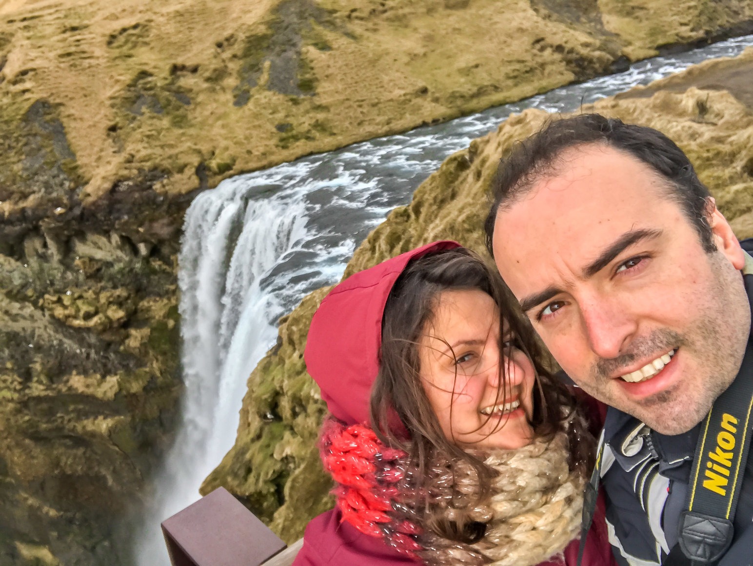travel bloggers climbing waterfalls in Iceland