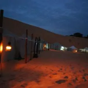Night view over the tents in the desert