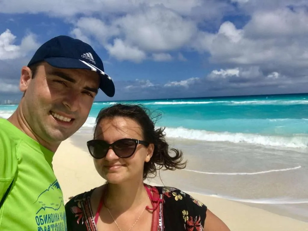 Travel couple on the beach in Mexico, Playa Marlin, Cancun