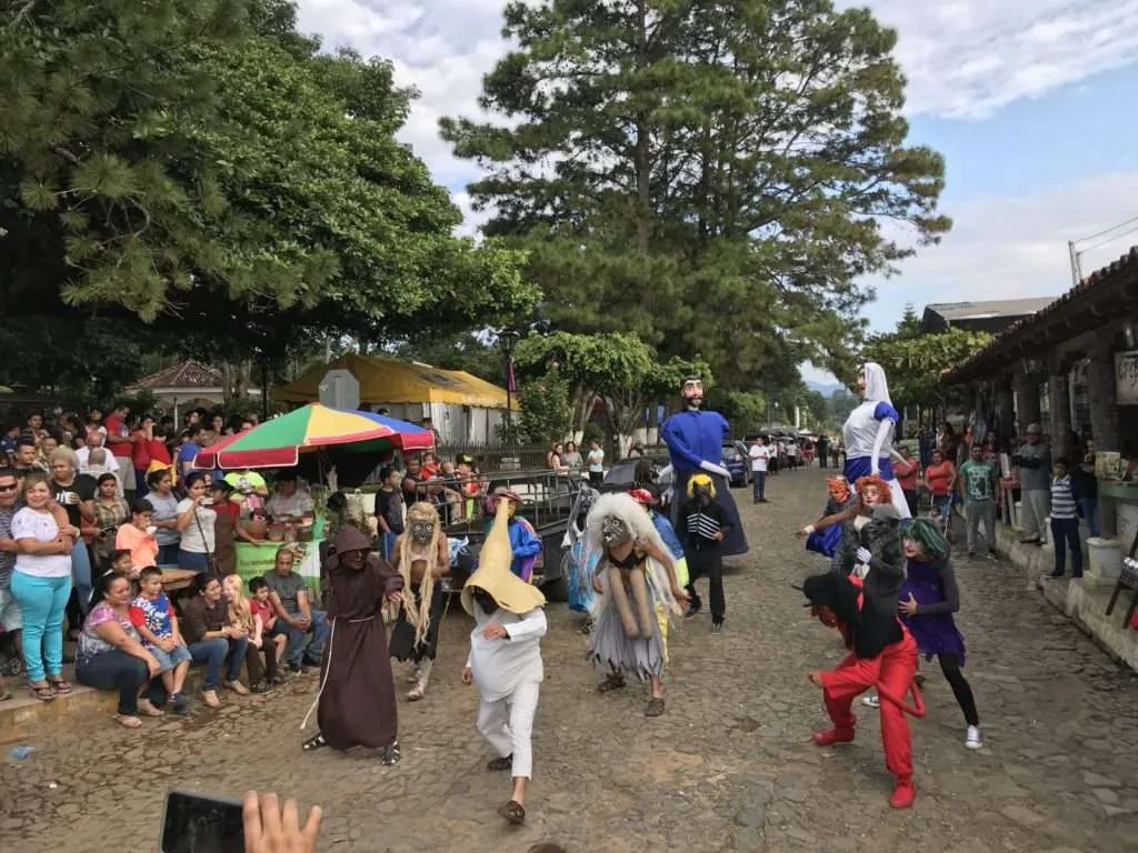 People with masks are dancing in Ataco, Ruta de las Flores, El Salvador