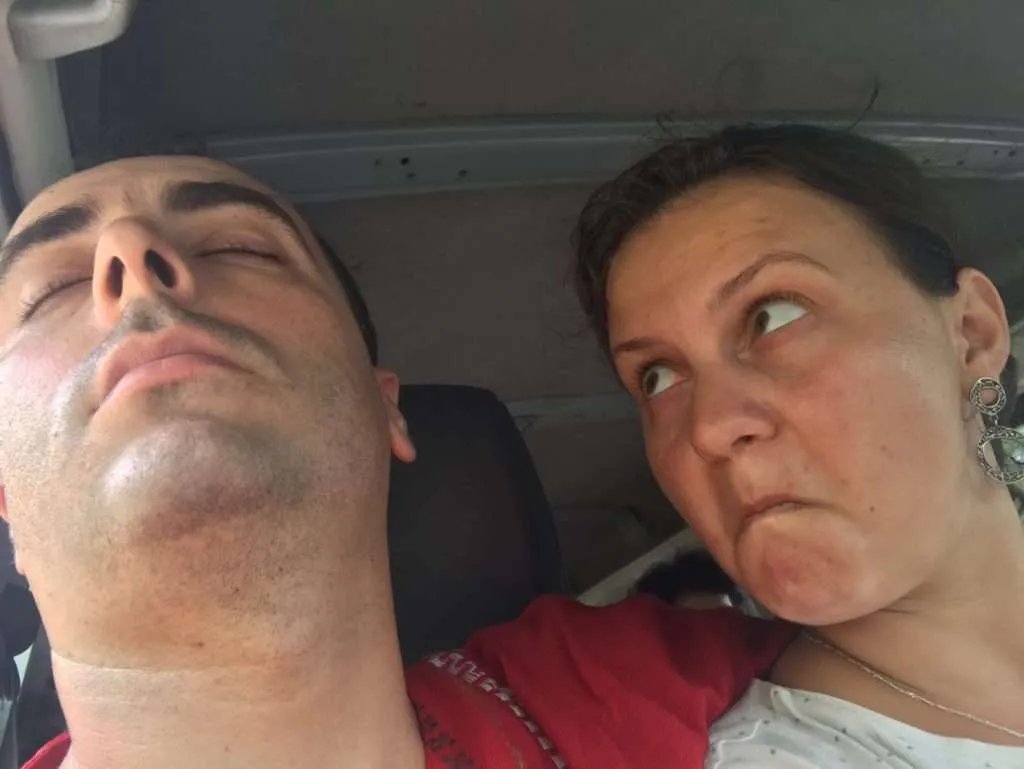 Bistra makes a selfie with Nace, who is sleeping deeply in the minibus heading to Tikal, Guatemala