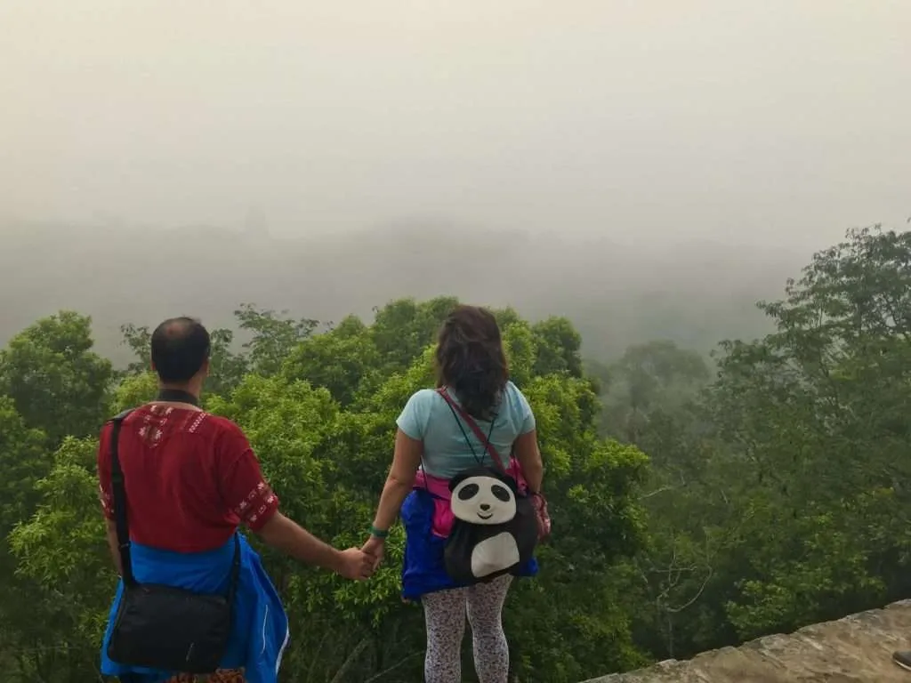 Looking over the foggy forest from Temple IV in Tikal ruins, Guatemala