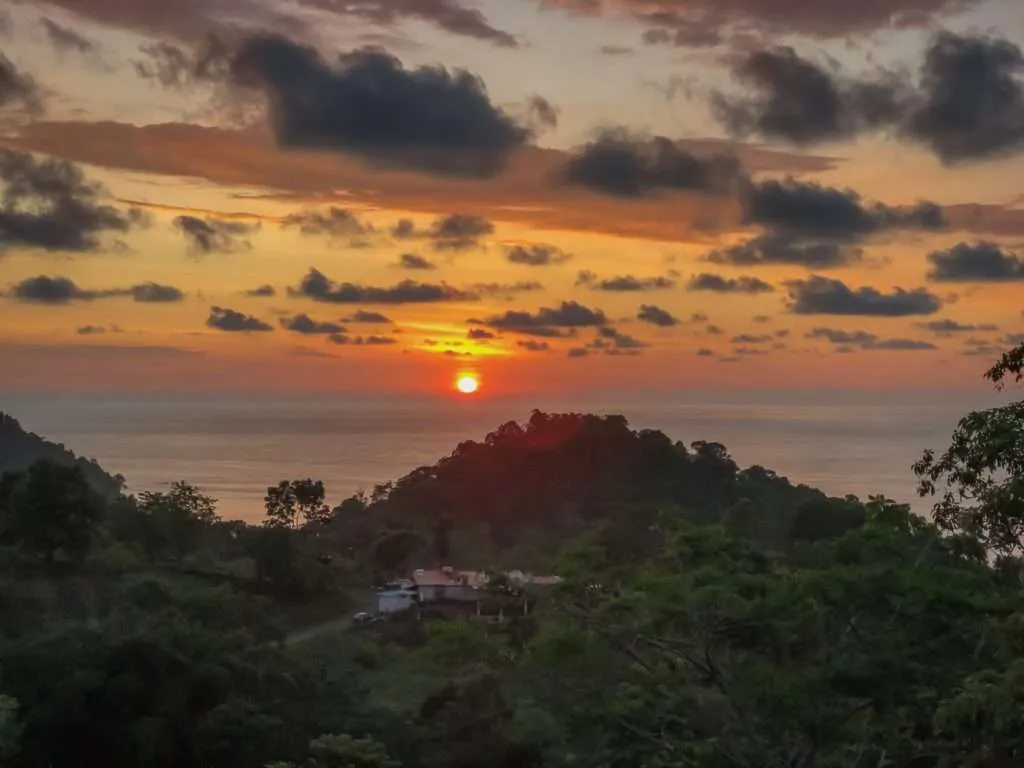Beautiful and colorful sunset over the ocean. Photo take from the terrace of our hostel in Manuel Antonio national park, Costa Rica