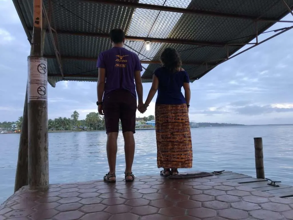 traveling couple at the Bocas del Toro pier in Panama