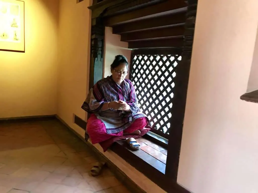 Nepal - our one-week cultural itinerary in Nepal, Kathmandu, lady sitting