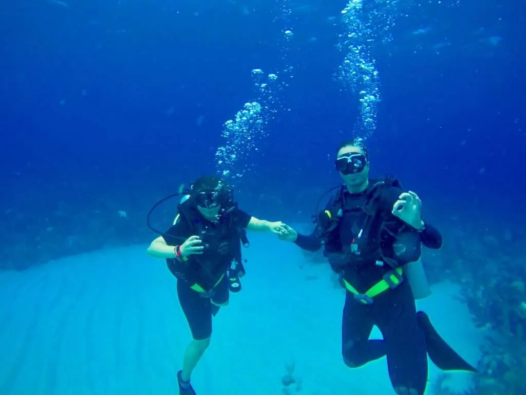 Couple travel quotes, scuba diving in Honduras
