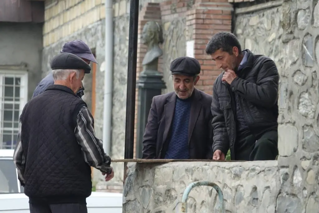Locals play backgammon in Kis, Azerbaijan, near the Albanian church