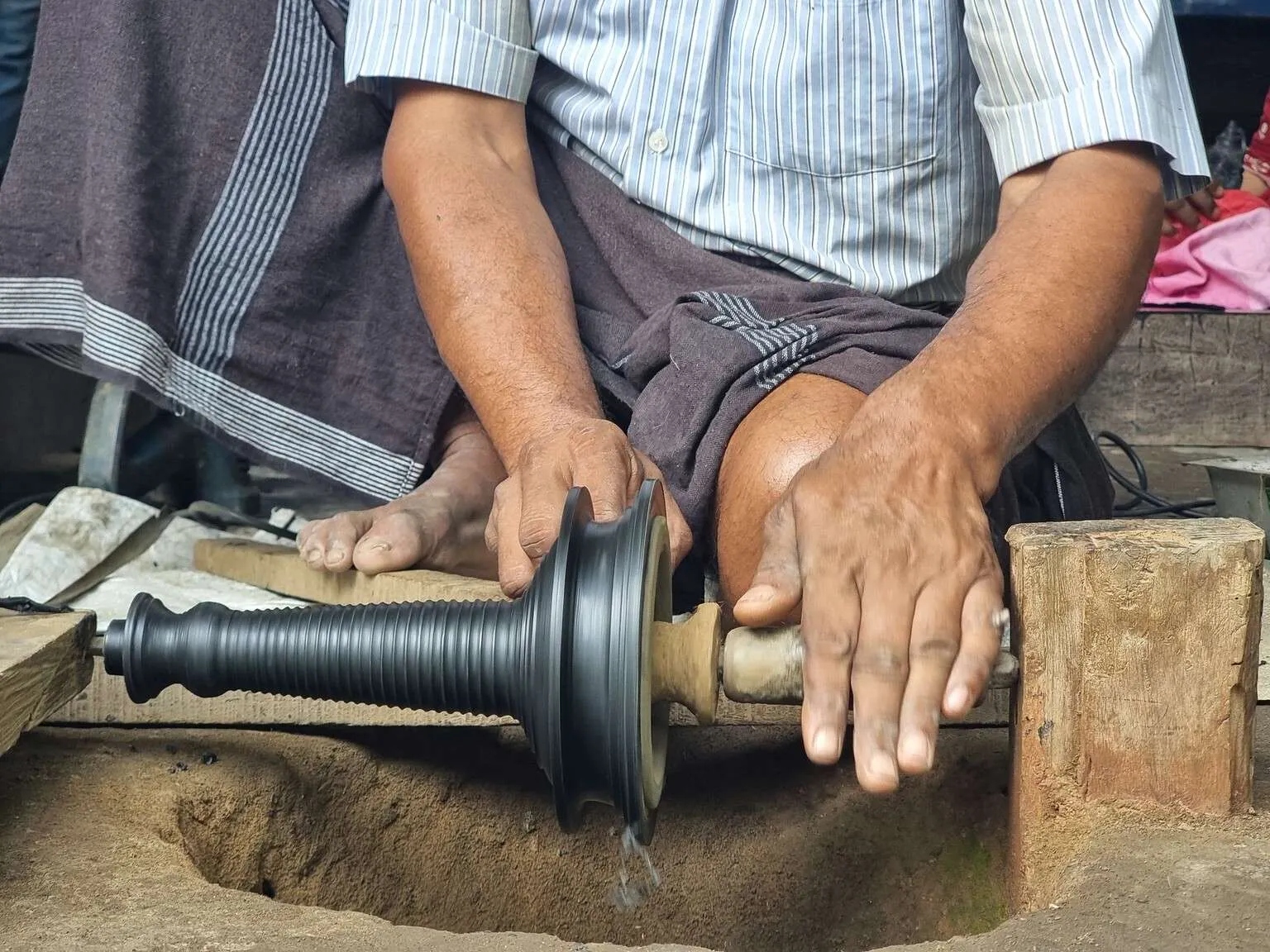 Handcrafting bronze in Kunhimangalam heritage village, Kannur, Kerala, India