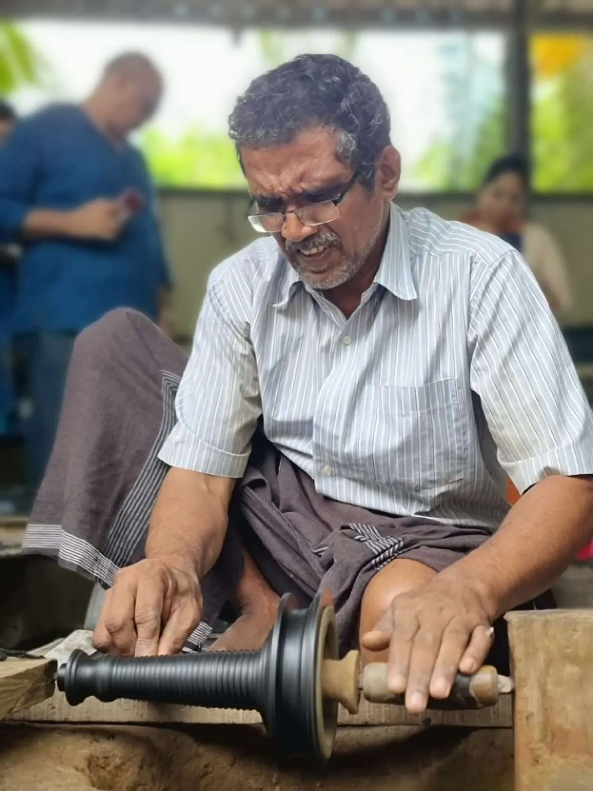 Handcrafting bronze in Kunhimangalam heritage village, Kannur, Kerala, India