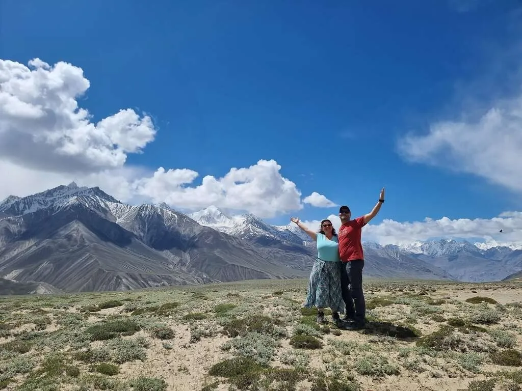 Bistra and Nace posing in front of a beautiful high altitude mountain landscape with showy peaks